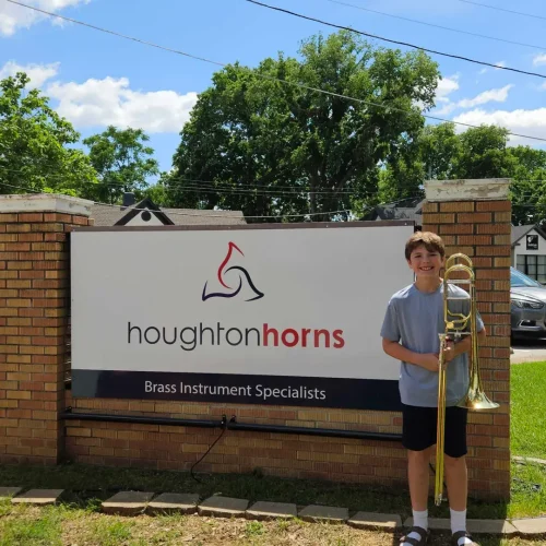 Customer posing with new trombone